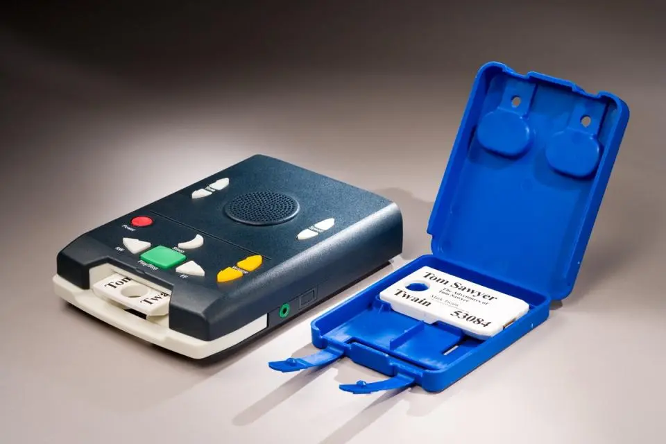 Photograph of digital talking book player with digital cartridge.